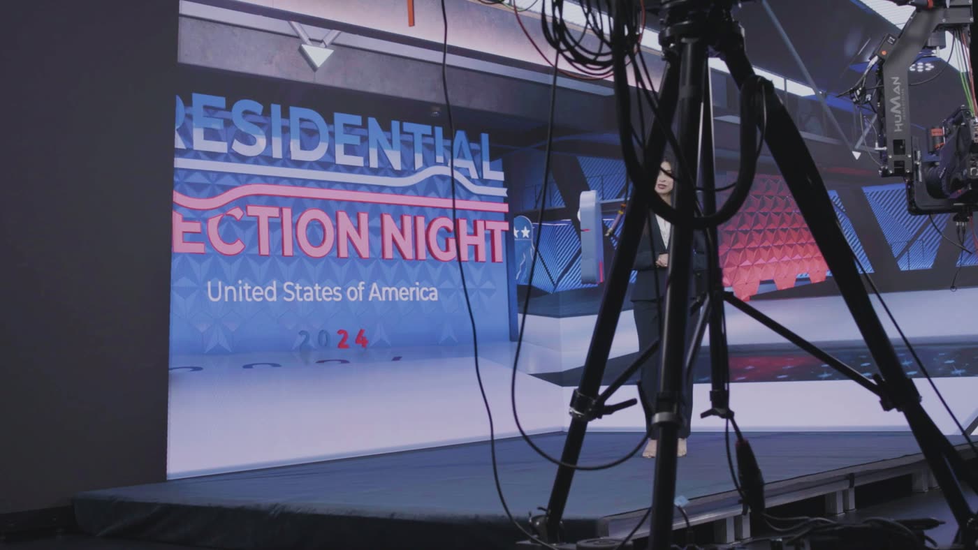 Studio floor with a broadcast camera and a presenter on set